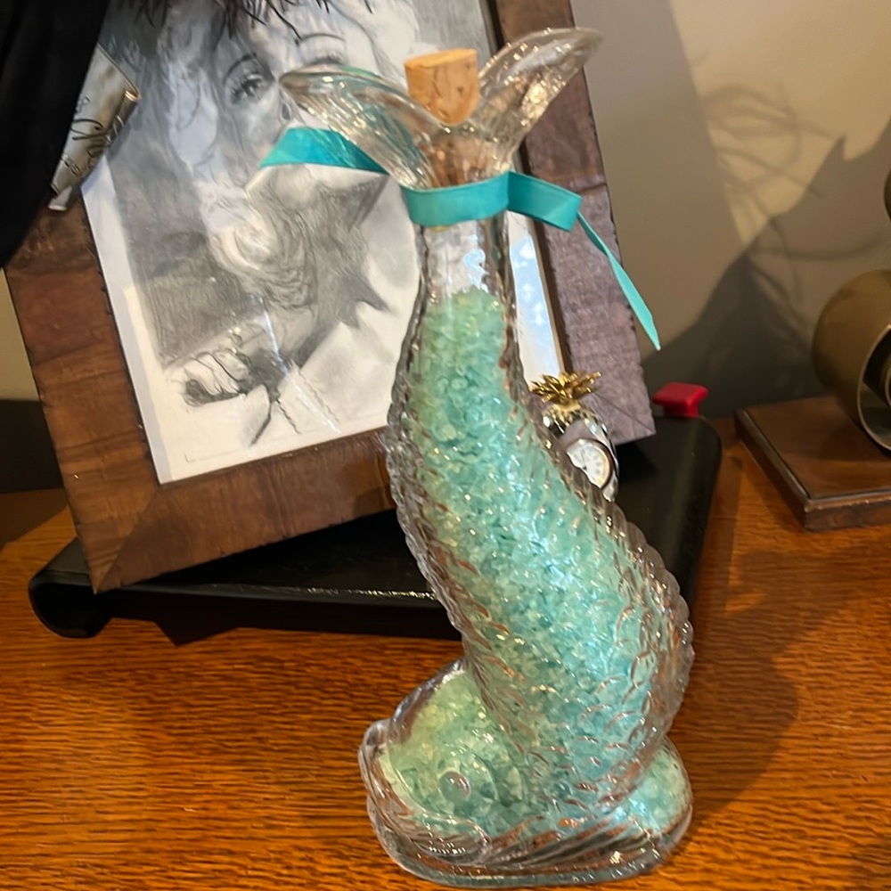 Adorable glass fish bottle with stopper filled with bath beads.  Adorable.